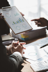 The sales department is having a monthly summary meeting to bring it to the department manager, they are verifying the correctness of the documents that are prepared before bringing in to the manager