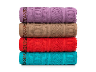 multicolored terry towels, rolled up and stacked on the table