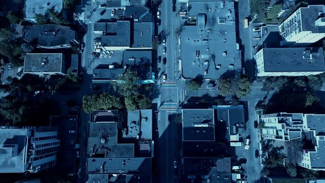 Rainbow crosswalk Davie Street Downtown Vancouver aerial drone 4k top view zoom into light traffic sunny bright day at a safe community promoting LGBTQ love peace prosperity and tolerance equality