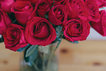Red roses in a vase as a gift for Valentines day