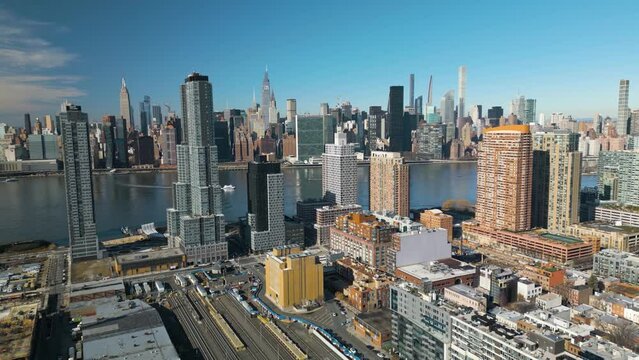 Beautiful Aerial View of Queens Skyscrapers along East River. Midtown Manhattan Skyline in Background