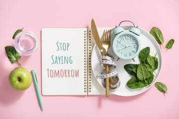 Quote Stop saying tomorrow Composition with cutlery, measuring tape, paper notebook, spinach,...