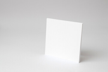 A blank square white empty paper on white background