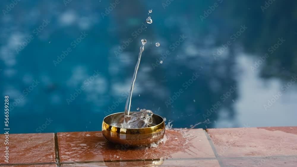 Poster water splashing in a small bowel sending ripples outwards in a circular pattern