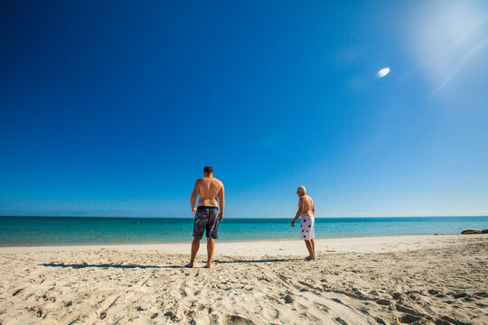 Two men at beach of Eagle Bay, Meelup Regional Park, Western Australia