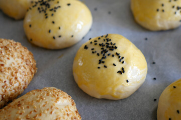 uncooked raw pastry dough sprinkled with black cumin,