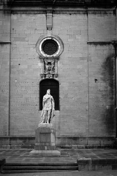 A statue guards the facade of the cathedral in Oviedo, Spain.