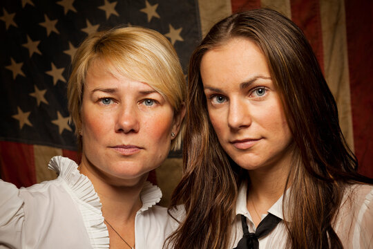 A mother and daughter pose for a portrait as a first time voter in the November 2012 United States Presidential Election for a project on new amercian voters.