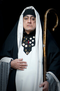 An old man holding a staff  during the annual Good Friday Pageant at St. Francis Assisi in Toronto, Ontario, Canada.