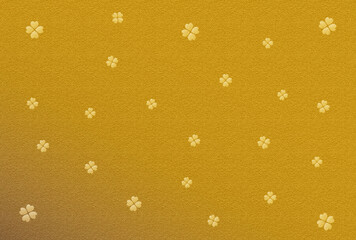 カード素材　四つ葉の柄の入った金色の背景