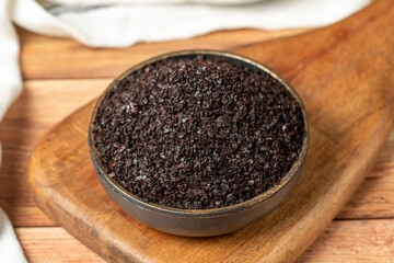 Black hot pepper spice in bowl. Chili pepper is a hot spice obtained by drying the pepper in the sun. Dry spice concept. local name isot. close up