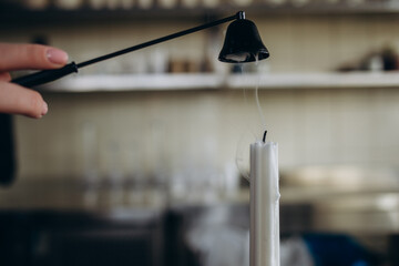 Abstract pastel background image made of silver old antique candle extinguisher handmade composition on black backdrop buying