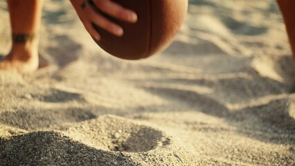 Playing american football on the beach - Powered by Adobe