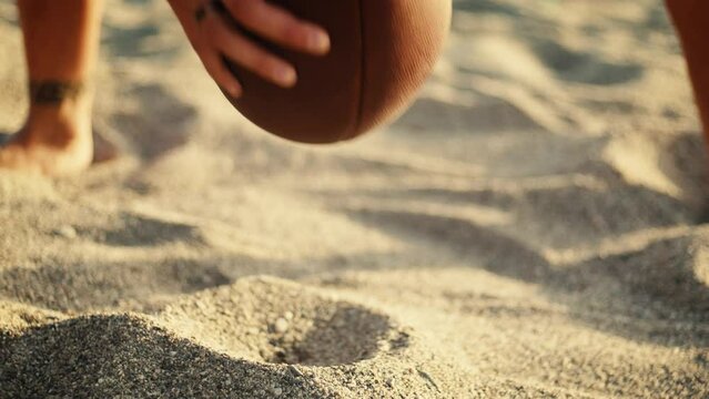 Playing american football on the beach 