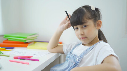 Portrait of happy young smiling child kid girl, Asian Thai woman isolated on white, people lifestyle.