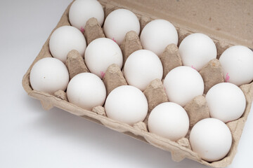 Fresh eggs on paper egg box