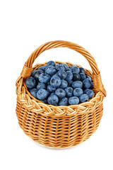 Fototapeta na wymiar Blueberry in wicker basket isolated on a white background