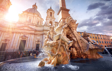 Rome. Italy. The Fountain of Four Rivers in Piazza Navona square. Ancient with sculptures during evening sunset. Famous touristic attraction - 566573888