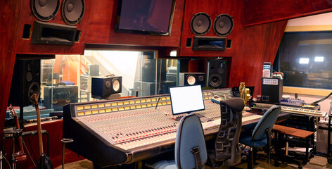 Music, studio and technology with recording equipment in an empty room for the entertainment...