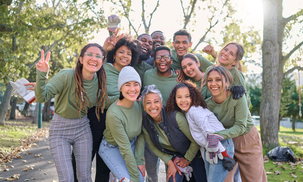 Teamwork, community and portrait of people cleaning park, forest and woods for healthy environment. Support, charity and group of volunteers smile for eco friendly, recycling and sustainable earth
