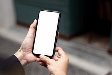 cell phone blank white screen mockup.hand holding texting using mobile on desk at office.background empty space for advertise.work people contact marketing business,technology