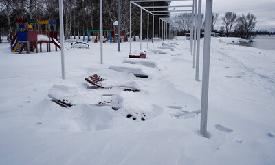 The Sunbeds In The Winter Over The Snow On Riverside Park. Ust-Kamenogorsk (kazakhstan)