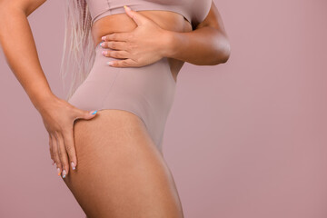 Close-up of young womans body, studio shoot.