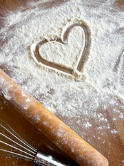 The painted heart flour on scattered white flour