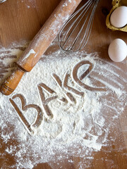 Inscription flour on scattered white bake