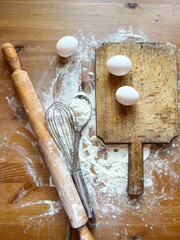 Ingredients and accessories for cooking flour on the kitchen table.
