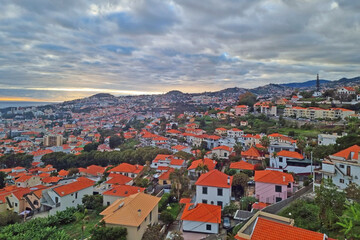 Fototapeta na wymiar Bright rooftops of houses on the island of MAdeira in the Atlantic Ocean.