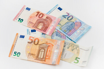 Obraz na płótnie Canvas Euro banknotes of different values. Euro cash background. closeup view. Salary, savings, European union economic crisis concept. 