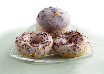 very tasty iced cakes doughnuts close up