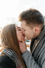 portrait of a happy couple kissing at sunset