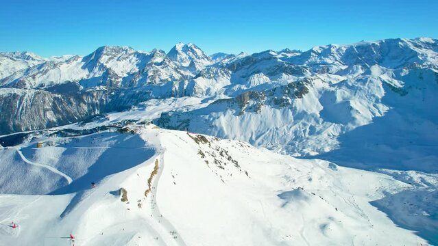 Courchevel, France: Aerial view of famous ski resort in French Alps (Savoie Alps) mountains in winter, sunny day with lot of snow - landscape panorama of Europe from above
