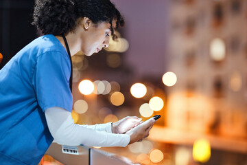 Night, doctor and woman texting in city while on a break, internet and search against a bokeh...