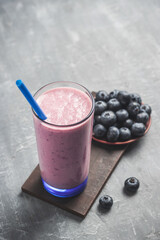 Blueberry smoothie drink in a glass, healthy eating concept