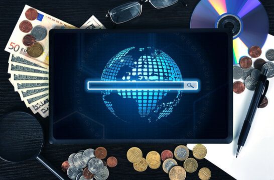 Desktop top view, tablet with digital earth and search line on digital screen.