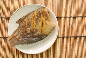 deep fried snake skin catfish or gourami on dish