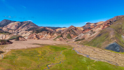 Famous Icelandic landscape in highlands, Landmannalaugar area - Iceland. Green lava fields and mountains on the background, aerial view from drone