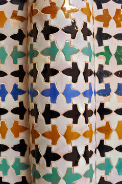 Arabic mosaic. Al Andalus tiles. Granada tiles. Arabic tiles from Spain. Original tiling of a column in the Patio of Mexuar. Alhambra of Granada. 