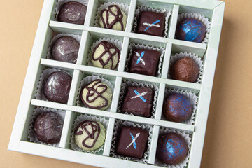 Sweet gift closeup. Chocolate candies. Set of 16 candies