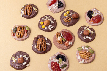 French sweets Mendiants. Chocolate candies with berries and nuts