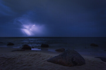 Fototapeta na wymiar thunderstorm with lightning on the sea night