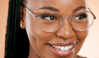 Black woman, face zoom and smile with glasses, vision and prescription lens isolated on studio background. Eyewear, eye care and healthcare for eyes, happy girl with fashion frame and optometry