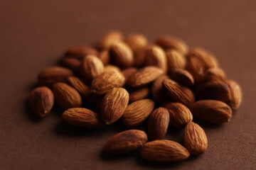 Nuts. Almond. Photo of nuts on a brown background