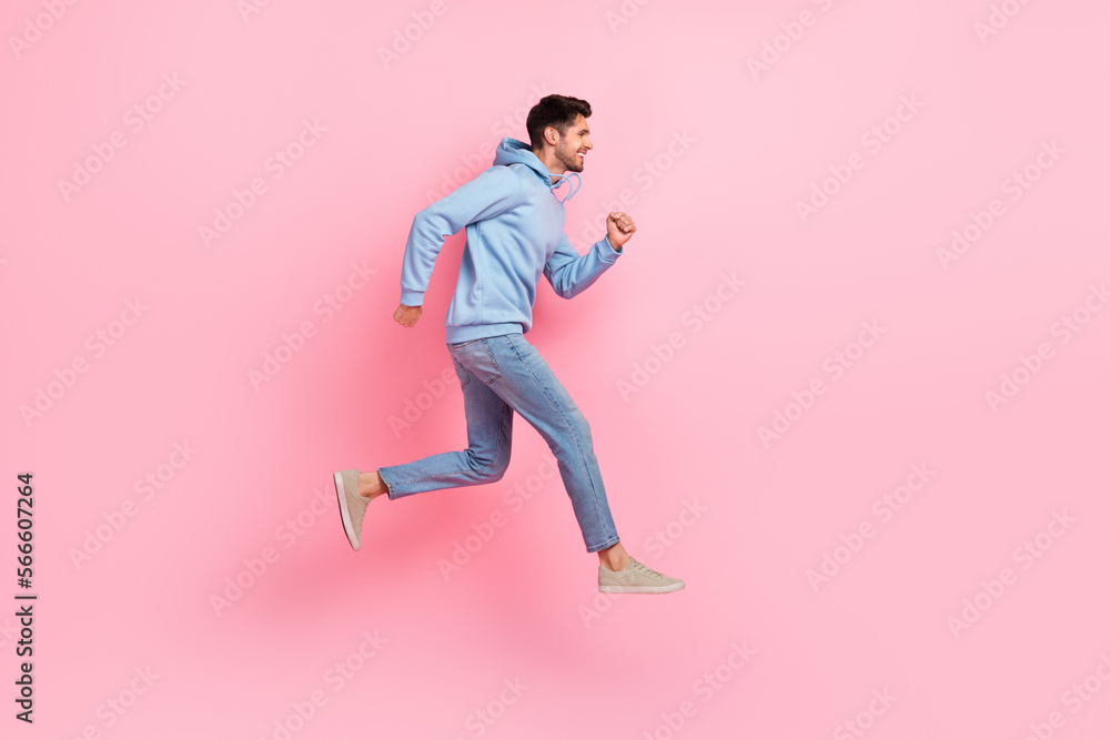 Poster full length profile side photo of optimistic stylish man moving empty space hurry buy low prices clo