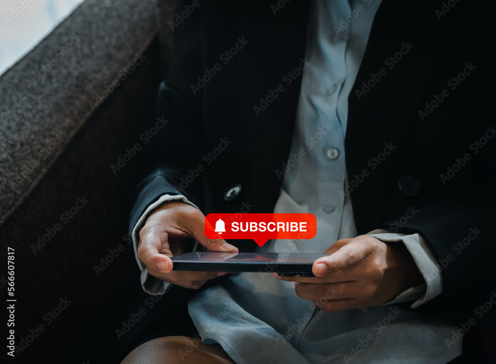 Poster subscription concept. big red subscribe button with bell icon appear on smart mobile phone in hand. 