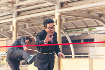 Business competition group of business people in formal suit run to finish line success goal...