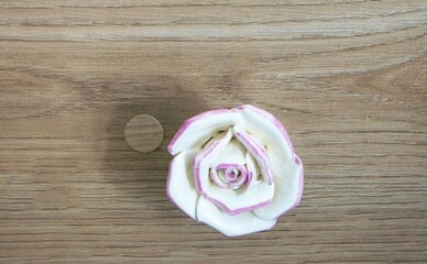 Α small white rose, in a wooden desk drawer, decoration